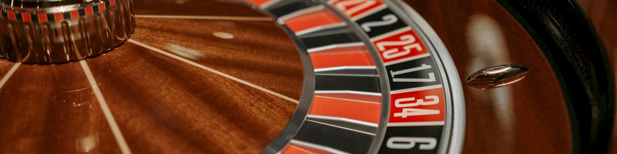 This image shows a close-up view of a roulette wheel, highlighting the numbered slots and the spinning mechanism.